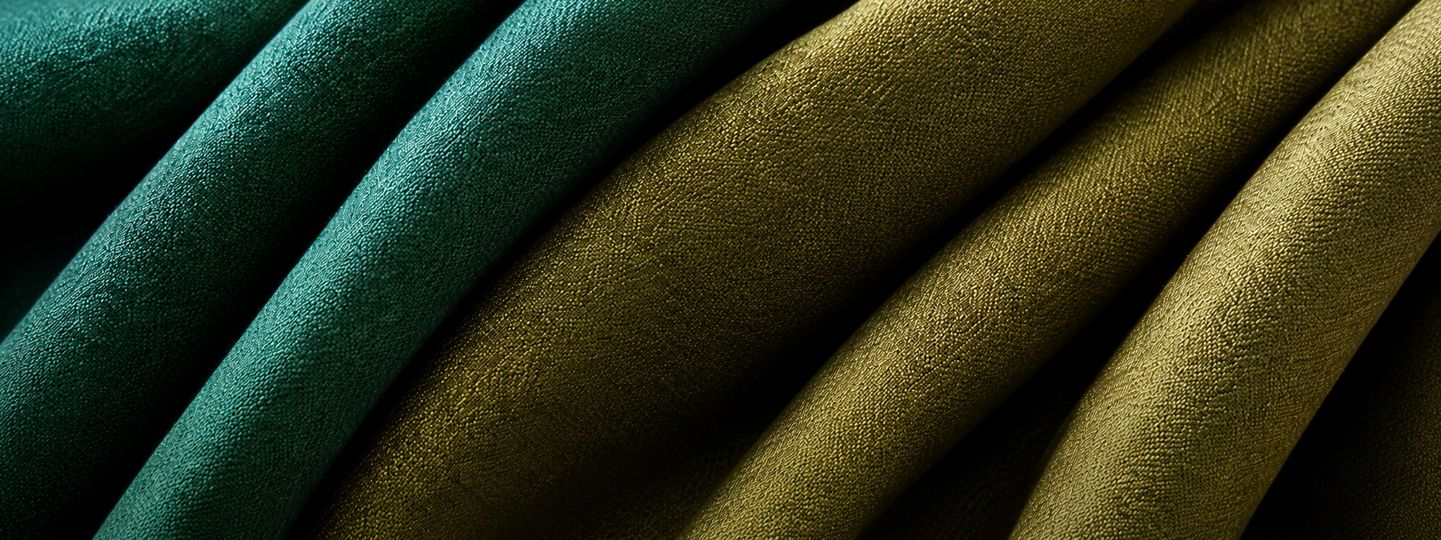 Folded upholstery fabrics in teal and olive tones